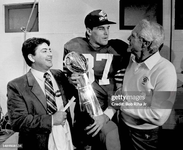 San Francisco 49ers Owner Eddie DeBartolo Jr. , WR Dwight Clark and Head Coach Bill Walsh celebrate victory with Vince Lombardi Trophy after Super...