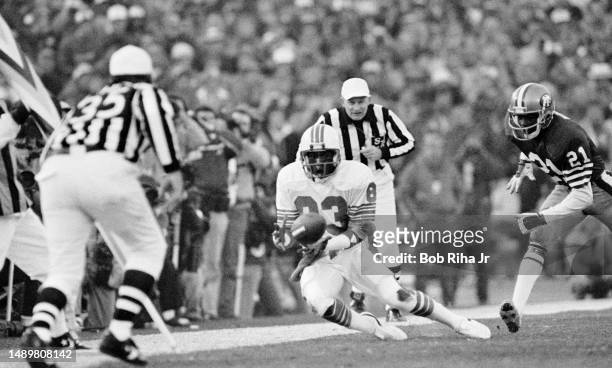 Miami Receiver Mark Clayton pulls in a pass just in-bounds as San Francisco CB Eric Wright closes in during game action at Super Bowl XIX of Miami...