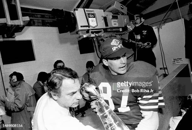 San Francisco 49ers WR Dwight Clark celebrates victory in locker room after Super Bowl XIX win over Miami Dolphins, January 20, 1985 in Stanford,...