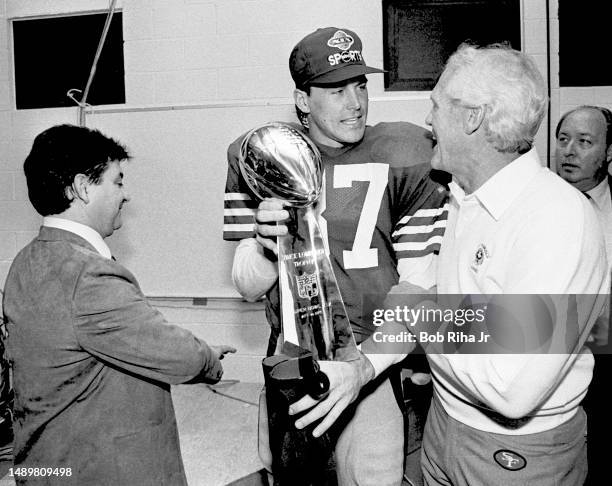 San Francisco 49ers Owner Eddie DeBartolo Jr. , WR Dwight Clark and Head Coach Bill Walsh celebrate victory with Vince Lombardi Trophy after Super...