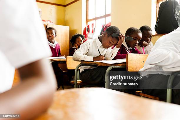 young african students in classroom - 3rd world stock pictures, royalty-free photos & images