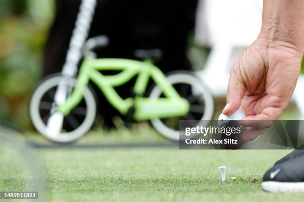 Tim Herron of the United states places his Titleist ball on the second tee during the third round of the Regions Tradition at Greystone Golf and...