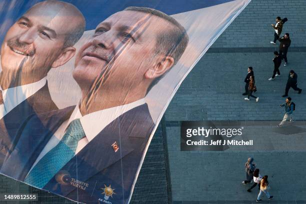 Flags fly over Taksim Square showing Turkey's President Recep Tayyip Erdogan and CHP presidential candidate, Kemal Kilicdaroglu on May 13, 2023 in...