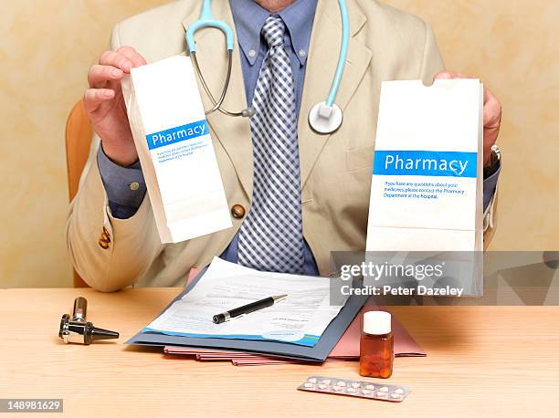doctor over prescribing drugs - prescription drugs dangers stock pictures, royalty-free photos & images