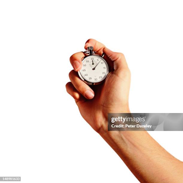 hand holding an analogue stop watch - instrument of time 個照片及圖片檔