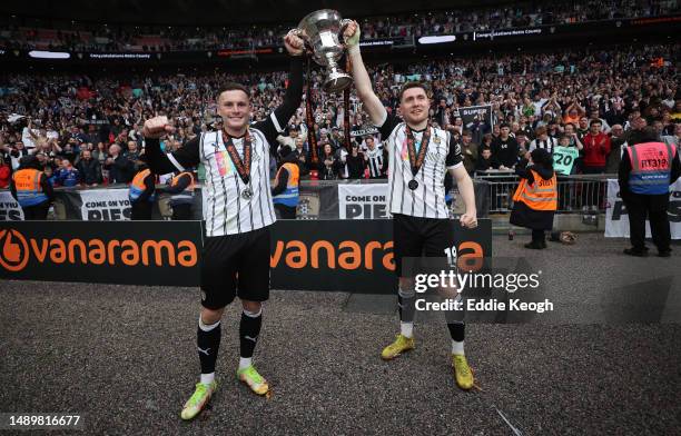 Macaulay Langstaff and Cedwyn Scott of Notts County celebrate with the National League Play-Off Final Trophy as players of Notts County celebrate...