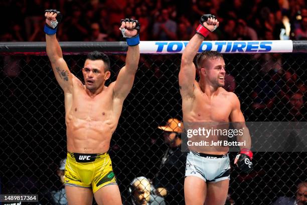 Douglas Silva de Andrade of Brazil and Cody Stamann react after their catchweight fight during the UFC Fight Night event at Spectrum Center on May...