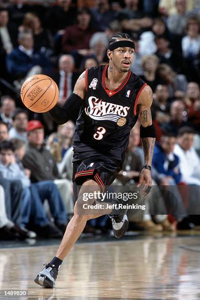 Guard Allen Iverson of the Philadelphia 76ers dribbles the ball during the NBA game against the Seattle SuperSonics at Key Arena in Seattle,...