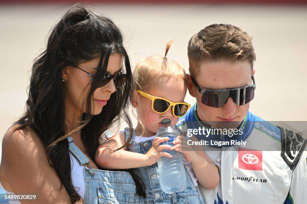 John Hunter Nemechek, driver of the Pye Barker Fire & Safety Toyota, his wife, Taylor, and daughter, Aspen Palmer stand on the grid during the...