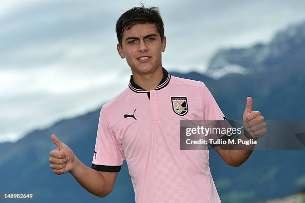 Paulo Dybala wears his new shirt during his presentation as the club's new signing after a US Citta di Palermo pre-season training session at Sport...