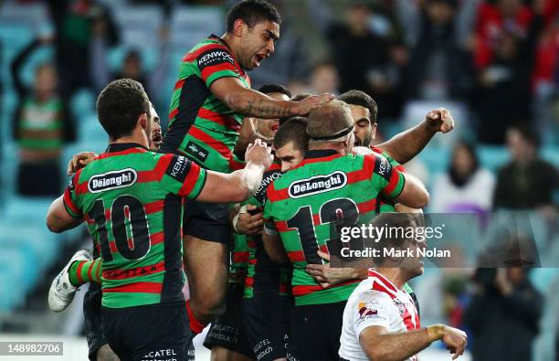 The Rabbitohs celebrate a try by Matt King during the round 20 NRL match between the South Sydney Rabbitohs and the St George Illawarra Dragons at...