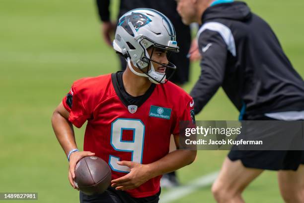 Bryce Young of the Carolina Panthers works through a drill during practice at Bank of America Stadium on May 13, 2023 in Charlotte, North Carolina.