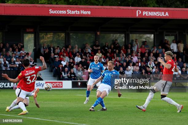 Ryan Croasdale of Stockport County has a shot blocked during the Sky Bet League Two Play-Off Semi-Final First Leg match between Salford City and...