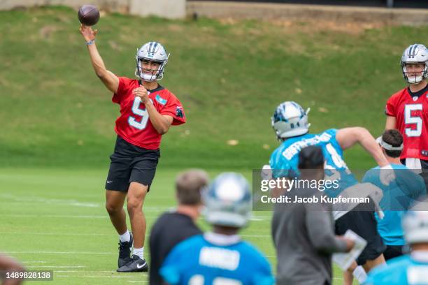 Bryce Young of the Carolina Panthers works through a drill during practice at Bank of America Stadium on May 13, 2023 in Charlotte, North Carolina.