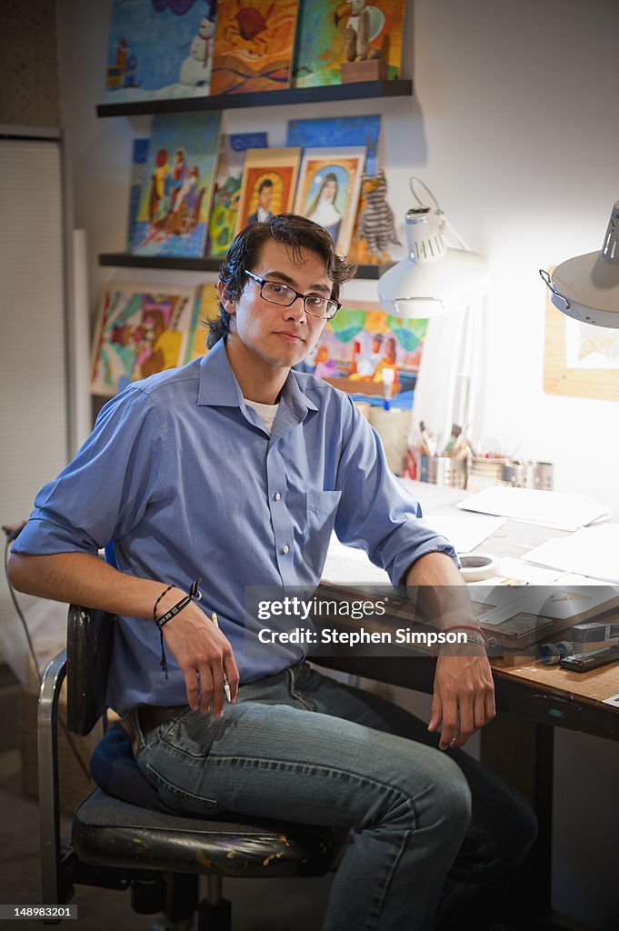 Illustrator/artist in his studio at work