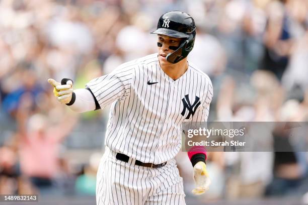 Aaron Judge of the New York Yankees reacts after hitting a two-run home run during the sixth inning against the Tampa Bay Rays at Yankee Stadium on...