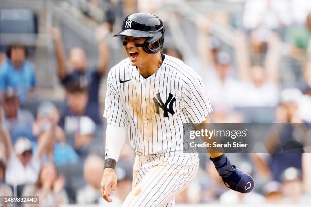 Anthony Volpe of the New York Yankees reacts after scoring on a wild pitch thrown by Ryan Thompson of the Tampa Bay Rays during the sixth inning at...