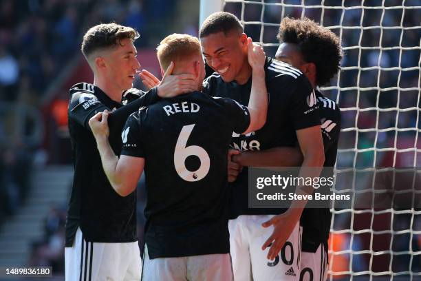 Carlos Vinicius of Fulham celebrates with his teamates after scoring the team's first goal during the Premier League match between Southampton FC and...