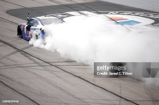 Kyle Larson, driver of the HendrickCars.com Chevrolet, celebrates with a burnout after winning the NASCAR Xfinity Series Shriners Children's 200 at...