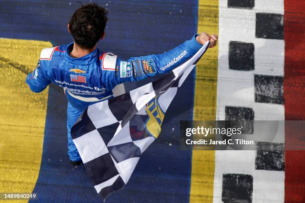 Kyle Larson, driver of the HendrickCars.com Chevrolet, celebrates with the checkered flag after winning the NASCAR Xfinity Series Shriners Children's...