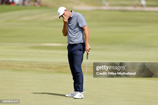 Scottie Scheffler of the United States reacts after missing a putt on the 13th green during the third round of the AT&T Byron Nelson at TPC Craig...