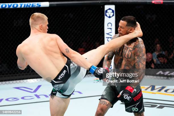 Ian Garry of Ireland kicks Daniel Rodriguez in their welterweight fight during the UFC Fight Night event at Spectrum Center on May 13, 2023 in...