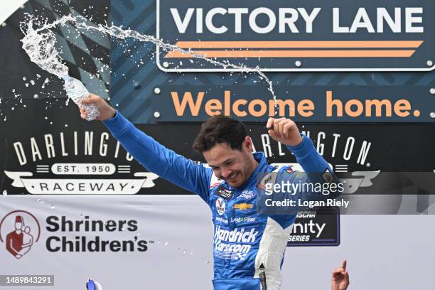 Kyle Larson, driver of the HendrickCars.com Chevrolet, celebrates in victory lane after winning the NASCAR Xfinity Series Shriners Children's 200 at...