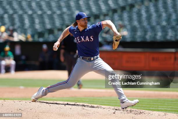 Jon Gray of the Texas Rangers pitches in the bottom of the second inning against the Oakland Athletics at RingCentral Coliseum on May 13, 2023 in...