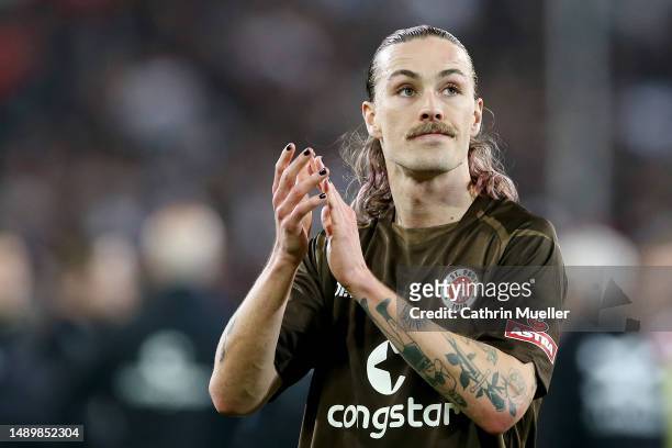 Jackson Irvine of St Pauli, wearing black nail varnish, applauds the fans after the Second Bundesliga match between FC St. Pauli and Fortuna...