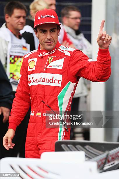 Fernando Alonso of Spain and Ferrari celebrates finishing first during qualifying for the German Grand Prix at Hockenheimring on July 21, 2012 in...