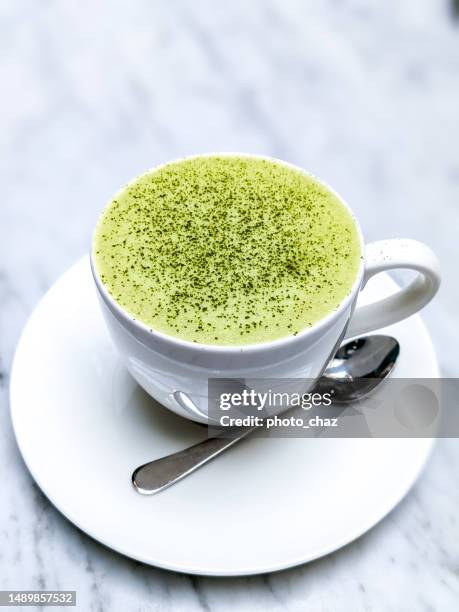 green tea matcha latte in a tea cup - coconut milk stock pictures, royalty-free photos & images