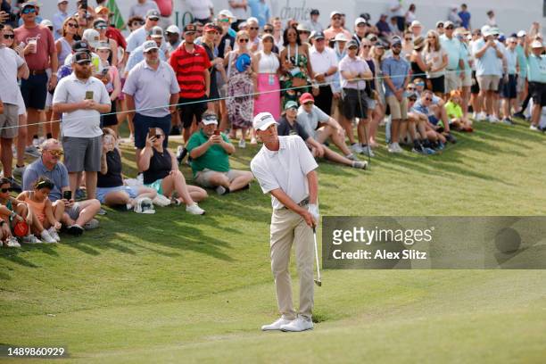 Steve Stricker of the United States watches his chip shot onto the 18th green during the third round of the Regions Tradition at Greystone Golf and...