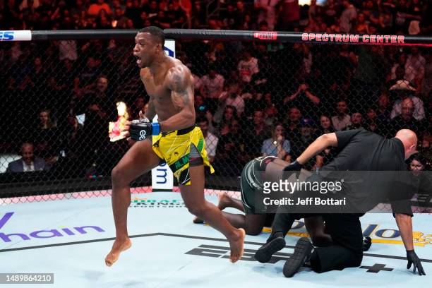 Jailton Almeida of Brazil celebrates his submission victory over Jairzinho Rozenstruik of Suriname in their heavyweight fight during the UFC Fight...