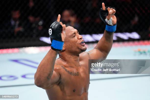 Jailton Almeida of Brazil celebrates his submission victory over Jairzinho Rozenstruik of Suriname in their heavyweight fight during the UFC Fight...