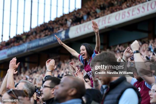 Aston Villa fans celebrate during the Premier League match between Aston Villa and Tottenham Hotspur at Villa Park on May 13, 2023 in Birmingham,...