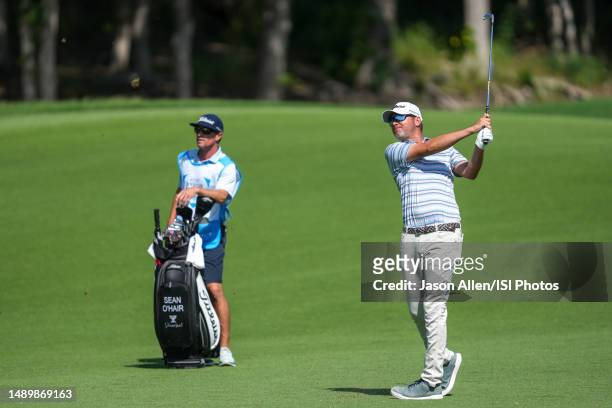 Sean OHair of the United States watches his approach shot on hole during the third round of the AT&T Byron Nelson at TPC Craig Ranch on May 13, 2023...
