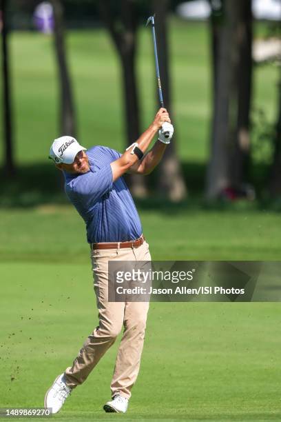 Bill Haas of the United States watches his approach shot on hole during the third round of the AT&T Byron Nelson at TPC Craig Ranch on May 13, 2023...