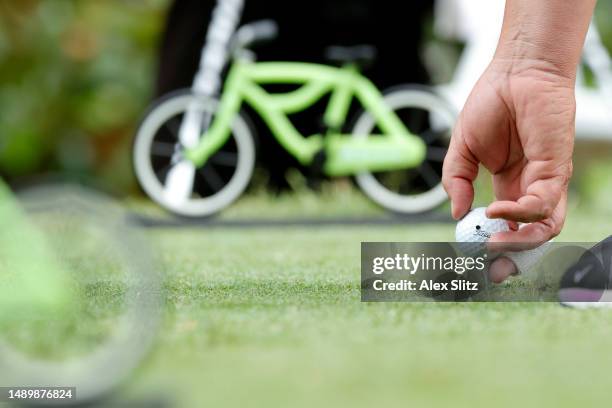 Tim Herron of the United states places his Titleist ball on the second tee during the third round of the Regions Tradition at Greystone Golf and...