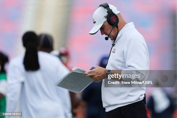 Head coach Skip Holtz of the Birmingham Stallions looks at the playbook during the third quarter against the Houston Gamblers at Protective Stadium...