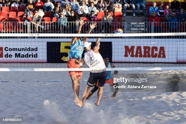 Alejandro Huerta Pastor of Spain competes with J. Li and Wang Y. W. Of China during the Volleyball World Beach ProTour Futures match between Spain...