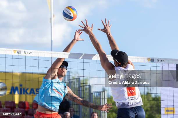 Javier Huerta Pastor of Spain competes with J. Li of China during the Volleyball World Beach ProTour Futures match between Spain and China at Parque...