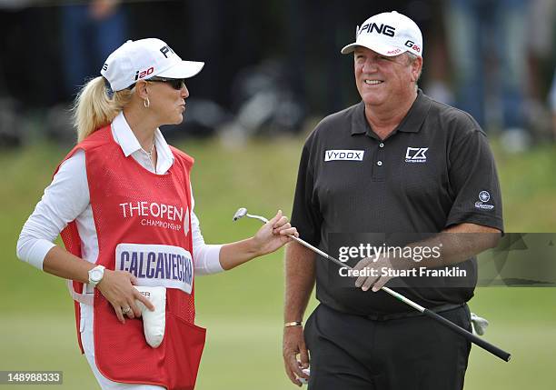 Mark Calcavecchia of the United States speaks with his wife and caddie Brenda Calcavecchia during the third round of the 141st Open Championship at...