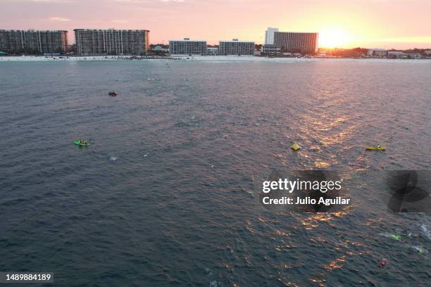 Athletes swim during the 2023 IRONMAN 70.3 Gulf Coast on May 13, 2023 in Panama City Beach, Florida.