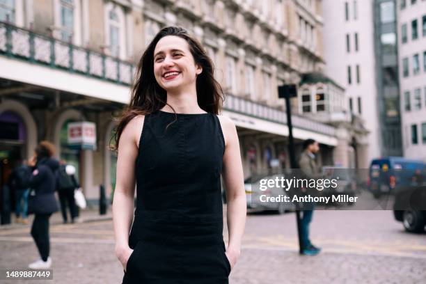 happy young woman with hands in pocket - modern judaism stock pictures, royalty-free photos & images