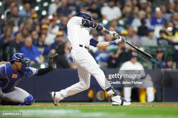 Christian Yelich of the Milwaukee Brewers hits a solo home run in the sixth inning against the Kansas City Royals at American Family Field on May 13,...