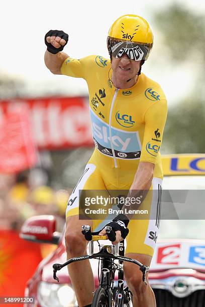 Bradley Wiggins of Great Britain and SKY Procycling punches the air with delight as he celebrates winning the stage and securing the yellow jersey of...
