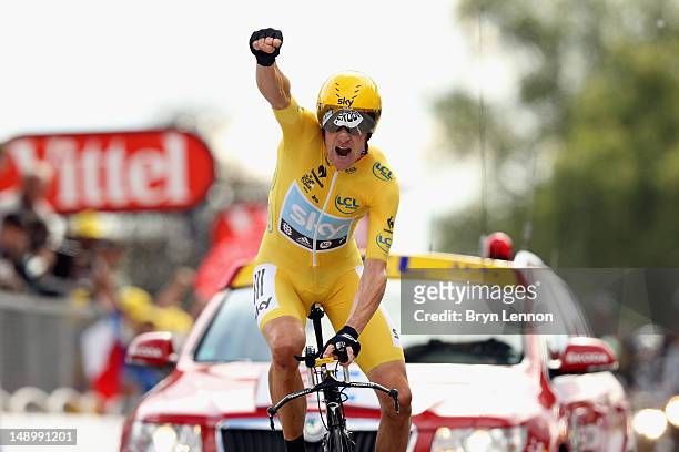 Bradley Wiggins of Great Britain and SKY Procycling punches the air with delight as he celebrates winning the stage and securing the yellow jersey of...