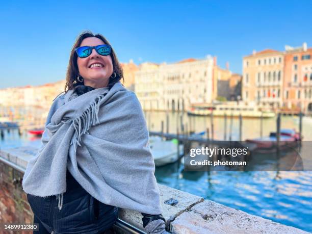 woman posing at grand canal on sunny day - white shawl stock pictures, royalty-free photos & images