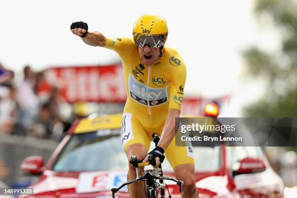 Bradley Wiggins of Great Britain and SKY Procycling punches the air with delight as he celebrates winning the stage and securing the yellow jersey of...