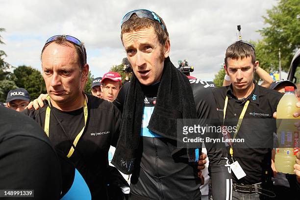 Bradley Wiggins of Great Britain and SKY Procycling makes his way to the podium after winning the stage and securing the yellow jersey of the general...